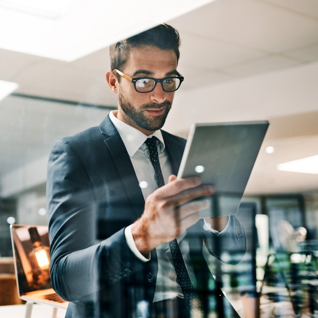 Man looking at tablet