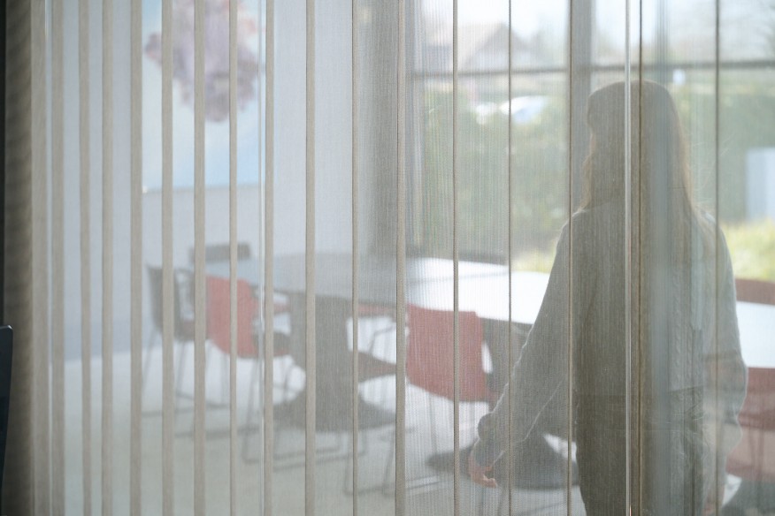 Person walking into empty meeting room